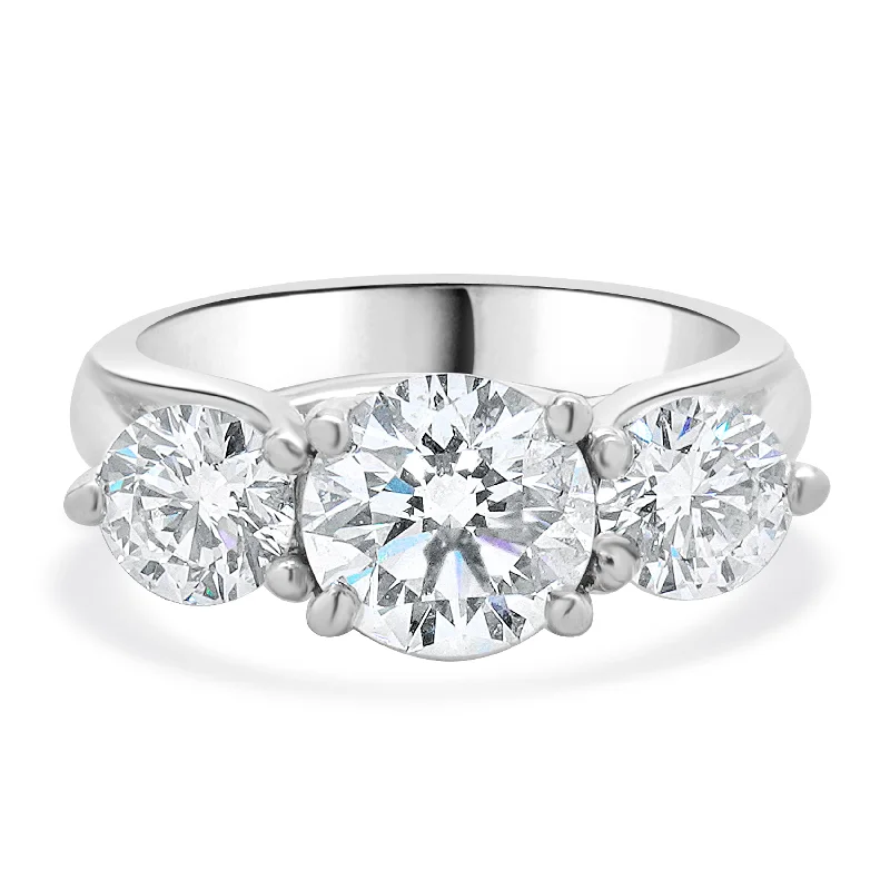 Custom engagement rings with halo settings-18 Karat White Gold Round Brilliant Cut Three Diamond Engagement Ring