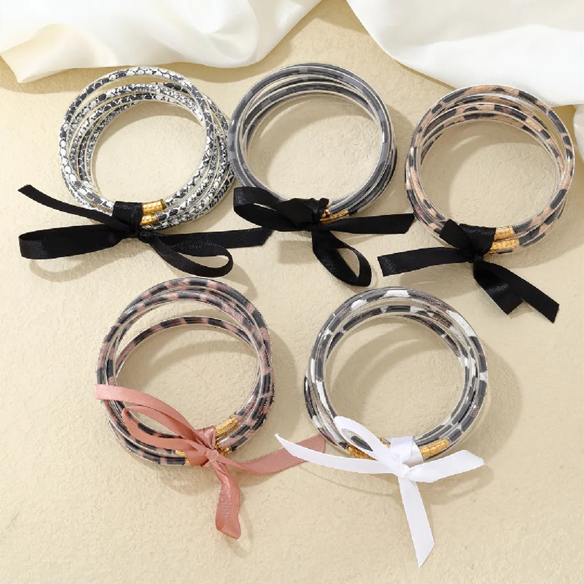 Gorgeous bracelets with garnet stones-Wholesale Jewelry Elegant Simple Style Printing Bow Knot Silica Gel Braid Appliques Bangle