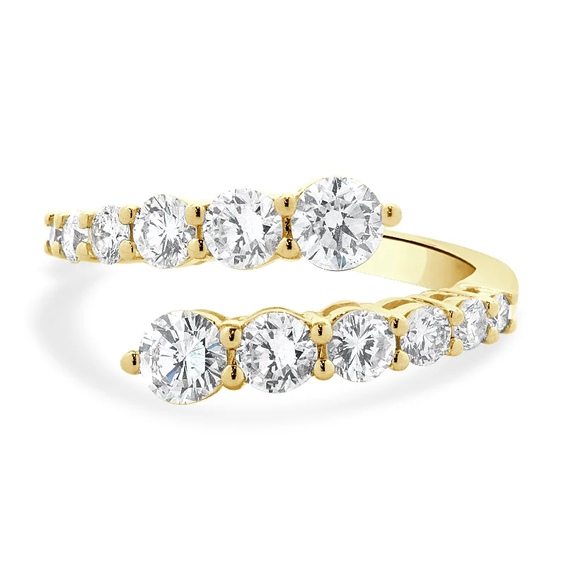 Simple engagement rings with sapphire accents-18 Karat Yellow Gold Graduated Diamond Bypass Ring